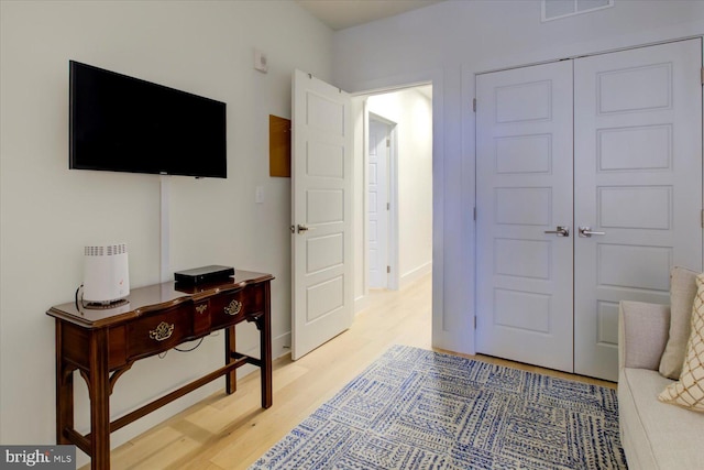 interior space featuring light wood-type flooring and visible vents