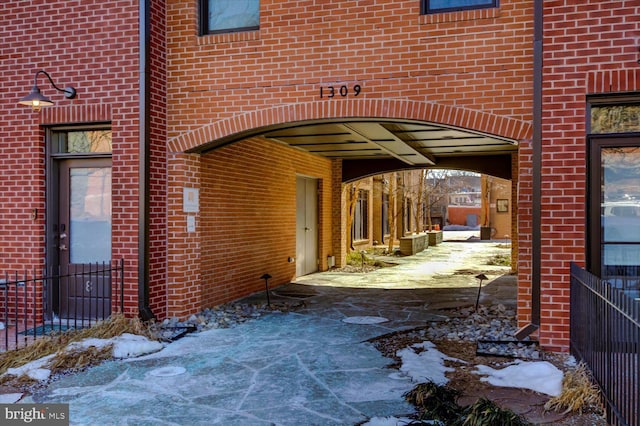 property entrance with brick siding