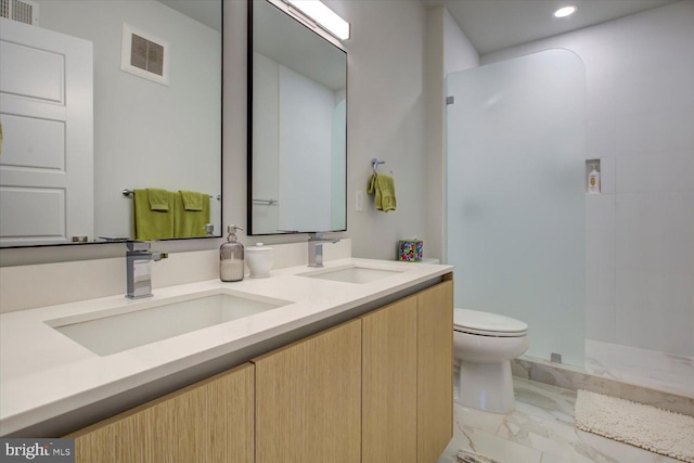 bathroom with toilet, marble finish floor, visible vents, and a sink