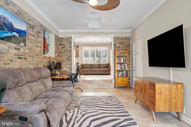 living room with ornamental molding and brick wall