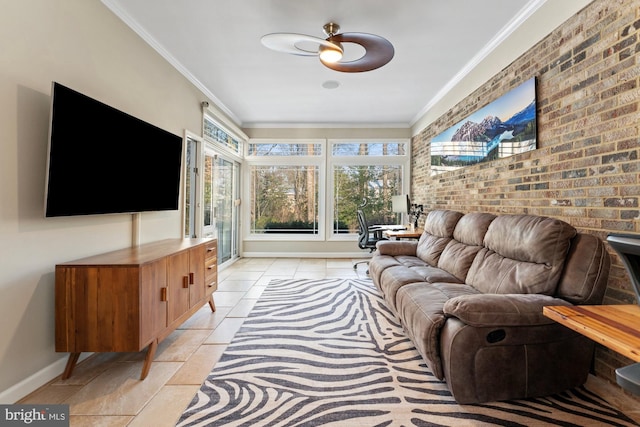 living room featuring light tile patterned floors, crown molding, and brick wall