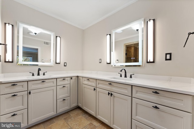 bathroom with crown molding and vanity