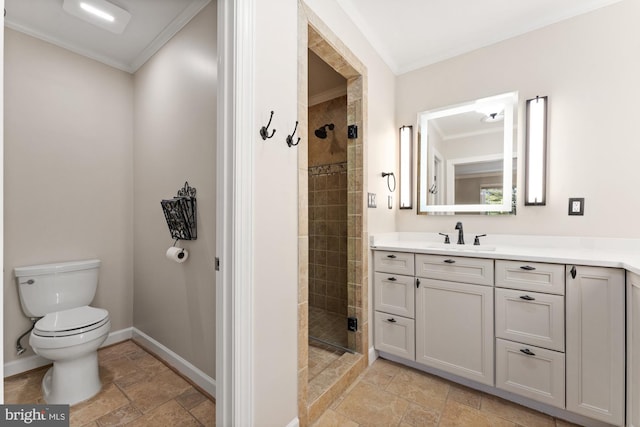 bathroom with crown molding, vanity, toilet, and a shower with door