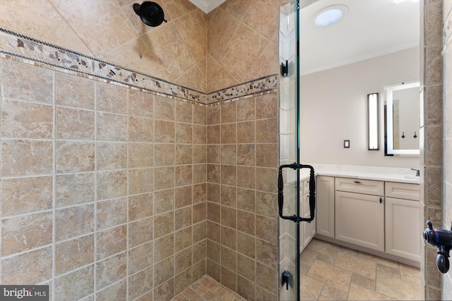 bathroom with vanity, ornamental molding, and walk in shower