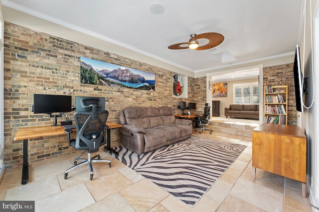 home office featuring ceiling fan, ornamental molding, and brick wall