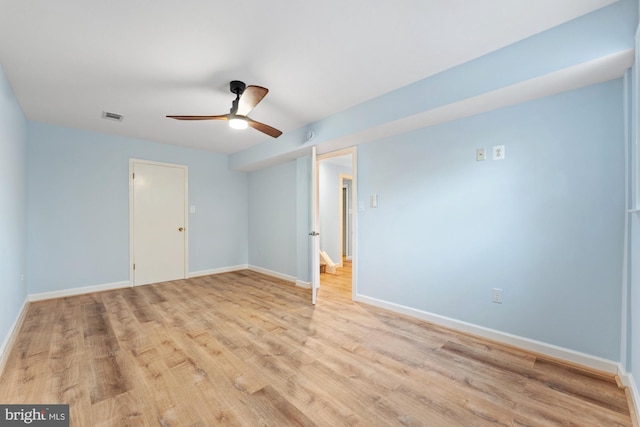 unfurnished room with ceiling fan and light wood-type flooring