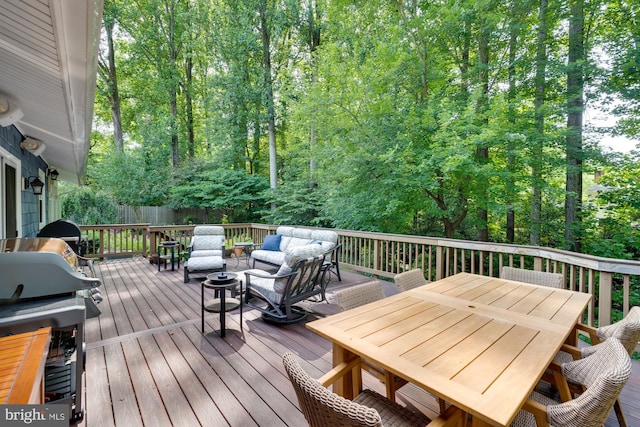 wooden terrace featuring area for grilling