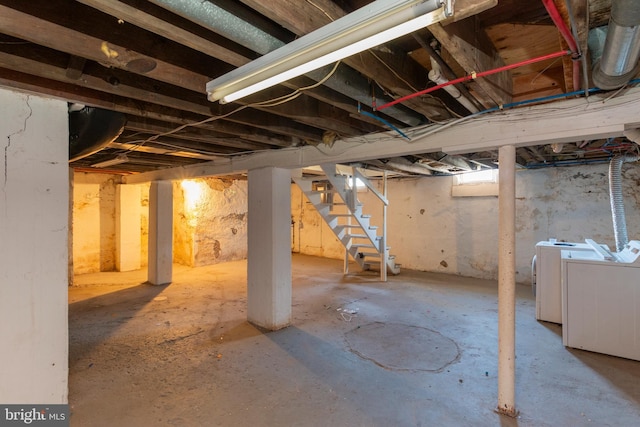 basement with washing machine and clothes dryer