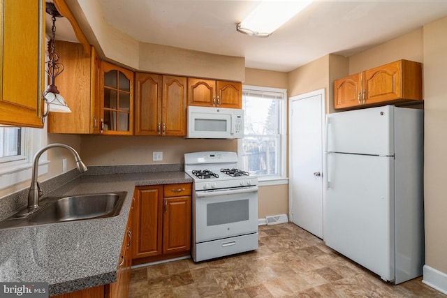 kitchen with white appliances and sink