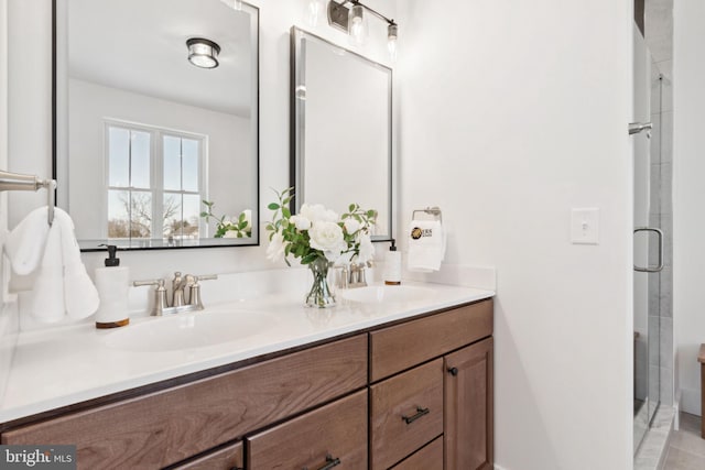 bathroom featuring walk in shower and vanity