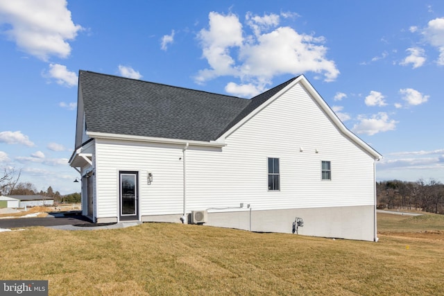 back of property featuring a lawn