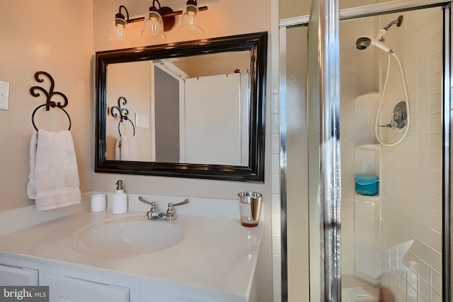 bathroom featuring vanity and an enclosed shower