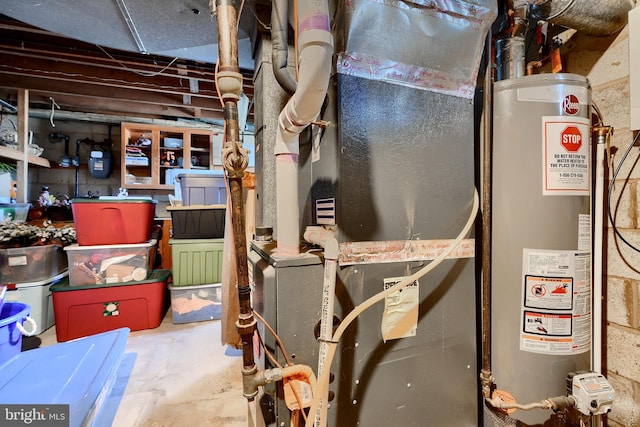 utility room featuring water heater