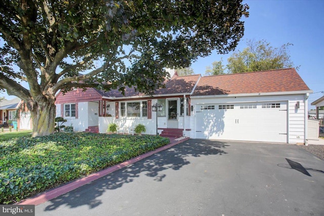 single story home featuring a garage