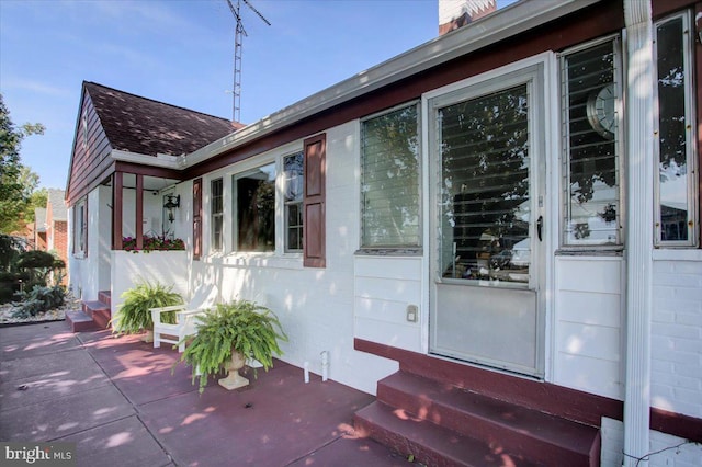 doorway to property with a patio area