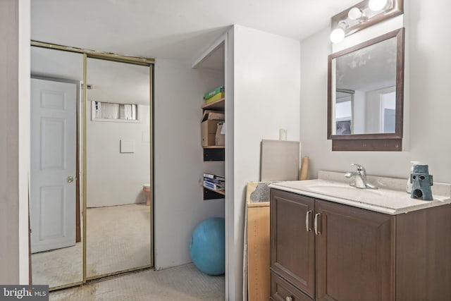 bathroom with tile patterned floors and vanity