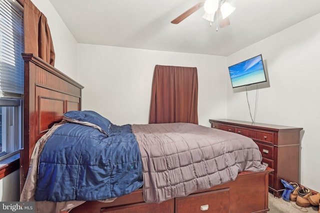 bedroom with light carpet and ceiling fan