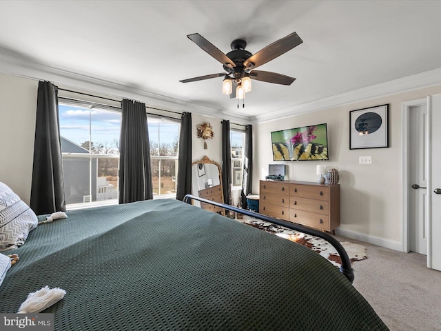 unfurnished bedroom featuring ceiling fan, ornamental molding, and carpet floors