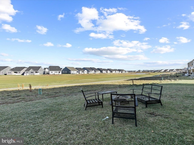 view of home's community with a lawn