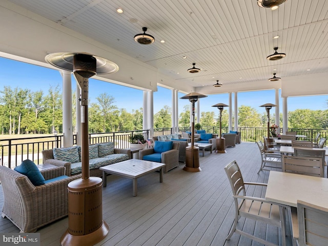 wooden terrace with outdoor lounge area