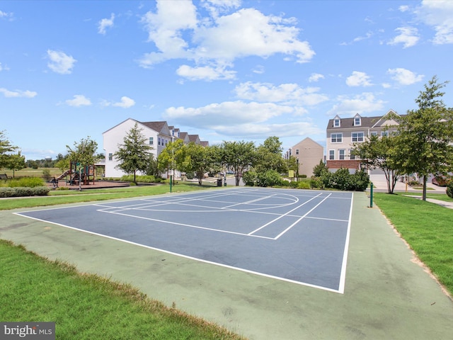 view of sport court with basketball court, a lawn, and a playground