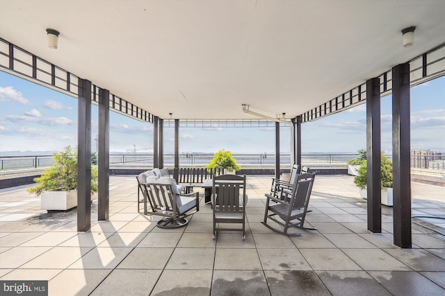 view of patio featuring a water view