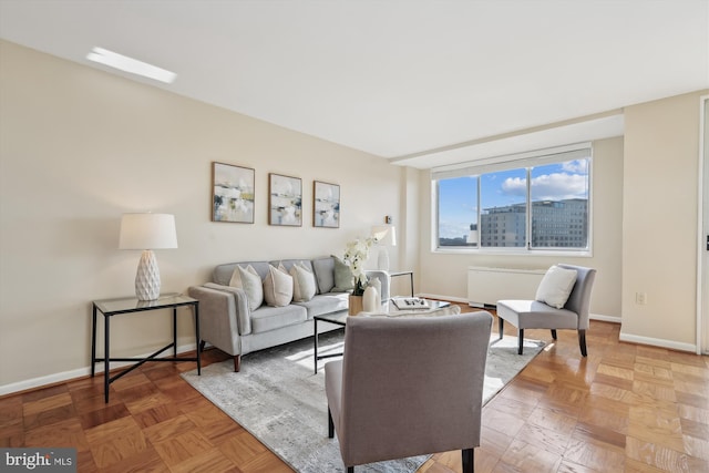 living room featuring parquet floors