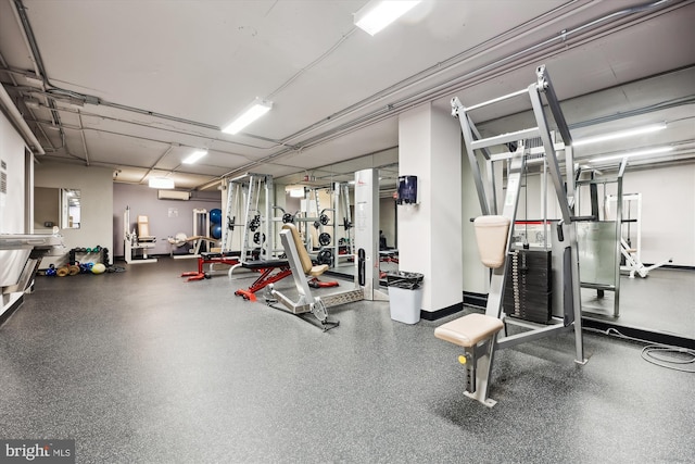 workout area with a wall mounted AC