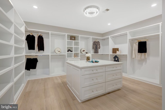 walk in closet with light wood-style floors and visible vents