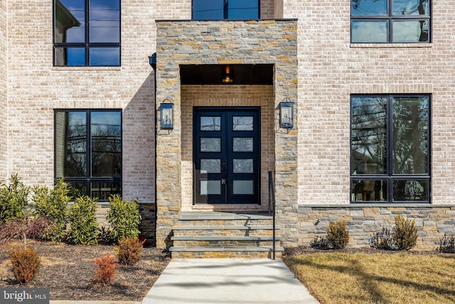 property entrance featuring brick siding