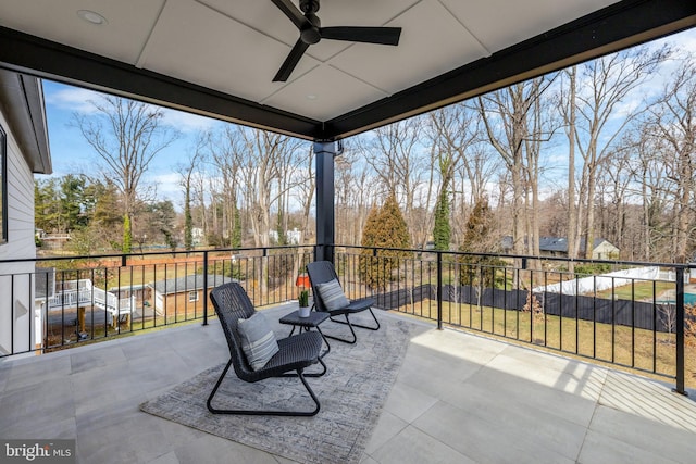 view of patio / terrace featuring a balcony and ceiling fan