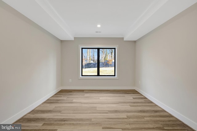 spare room with light wood-style floors, recessed lighting, visible vents, and baseboards