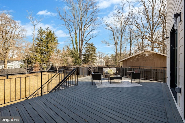 wooden terrace featuring fence and an outdoor hangout area