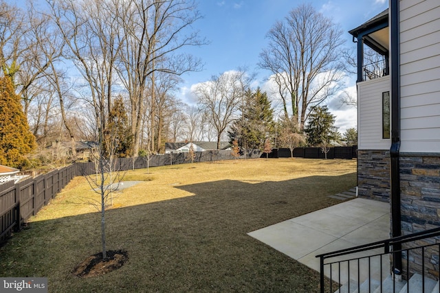 view of yard with a fenced backyard and a patio