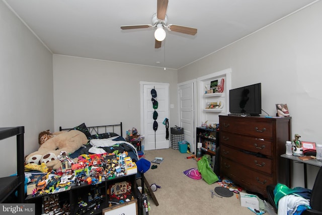 carpeted bedroom with ceiling fan