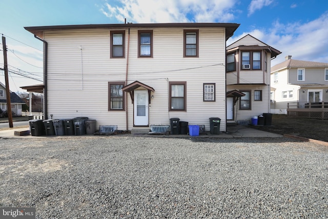 back of house featuring central AC unit