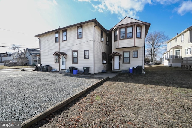 rear view of property featuring central air condition unit