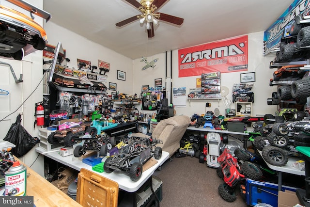 garage featuring a workshop area and ceiling fan