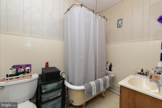 full bathroom featuring tile walls, vanity, toilet, and shower / bath combo with shower curtain