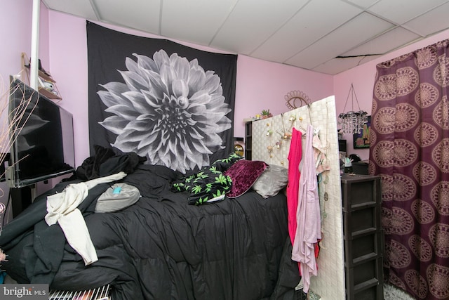 bedroom with a paneled ceiling