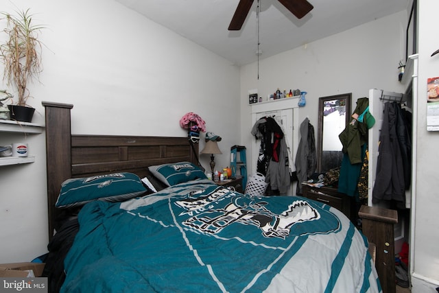 bedroom with lofted ceiling and ceiling fan