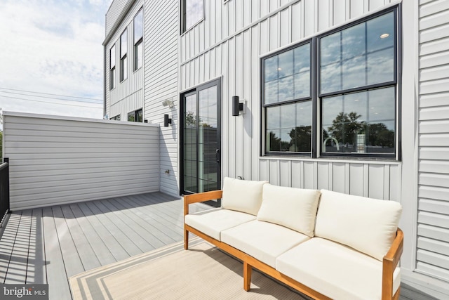 wooden deck with an outdoor hangout area