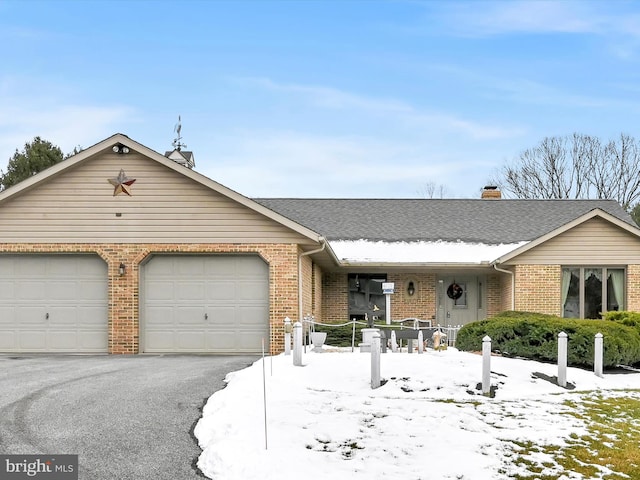 single story home featuring a garage