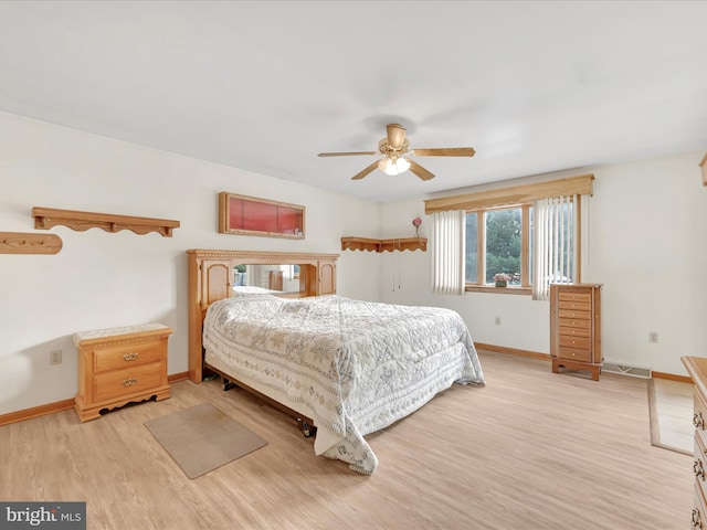 bedroom featuring light hardwood / wood-style floors and ceiling fan