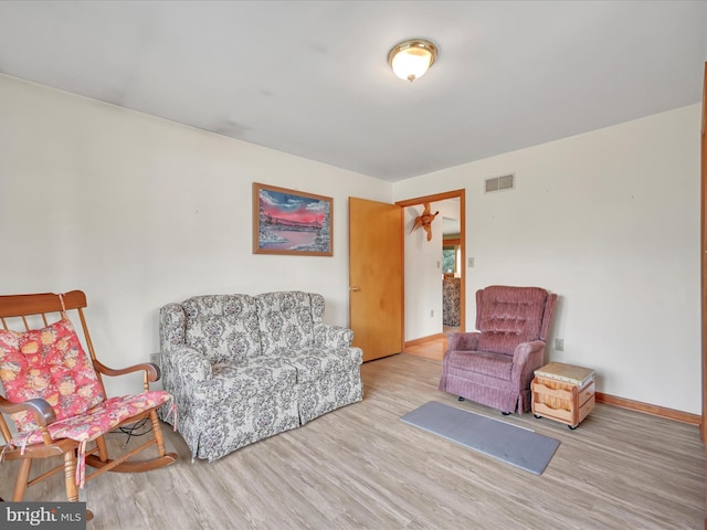 living area with light hardwood / wood-style floors