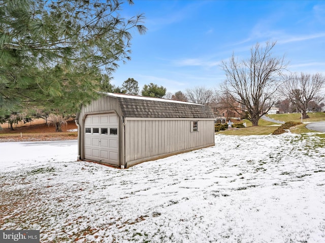 view of snow covered garage