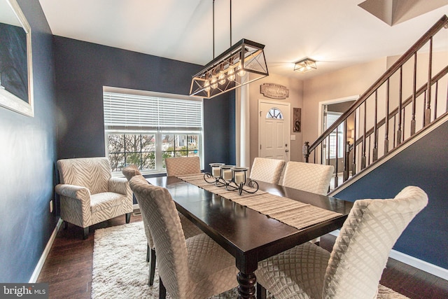 dining space featuring dark wood-type flooring