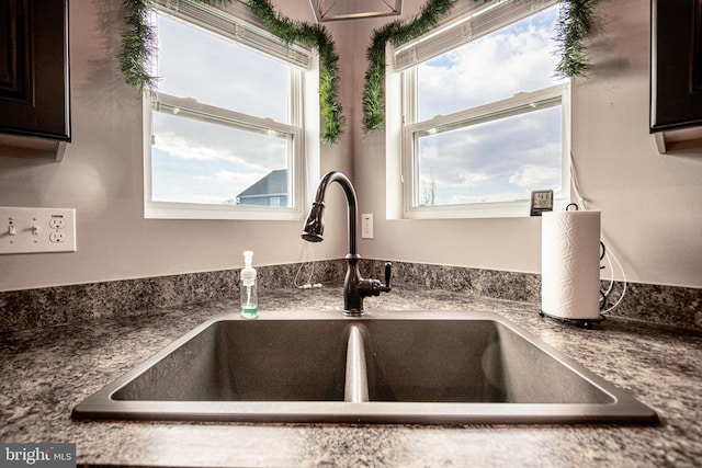 details featuring sink and stone countertops