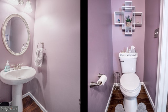 bathroom featuring wood-type flooring, sink, and toilet