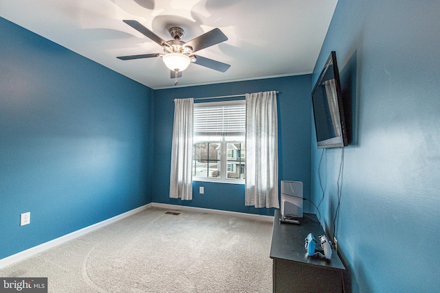 carpeted empty room with ceiling fan